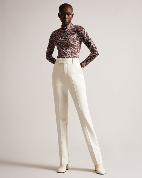 JUMILA-Tops-JUMILA is the ultimate in feminine style. Figure hugging fabric and our exclusive Wings print come together in this dainty top, which features a high neckline, long sleeves, and stretch fabric. This wardrobe staple can be can be worn with anything from tailored trousers to floaty skirts.The fabric of this product is made with 96% recycled polyester. Using recycled polyester helps divert plastic waste from ending in landfills and helps us to reduce our dependency on virgin materials. Fitted mesh